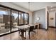 Dining room features a modern light fixture, large sliding doors to outdoor seating and fireplace at 1291 S Gaylord St, Denver, CO 80210