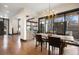 Open dining room includes access to wet bar, and outdoor dining with fireplace at 1291 S Gaylord St, Denver, CO 80210