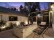 Backyard fire pit with an outdoor television and comfortable seating at 1291 S Gaylord St, Denver, CO 80210
