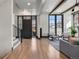 Modern foyer with hardwood floors, stylish lighting, and lots of natural light at 1291 S Gaylord St, Denver, CO 80210