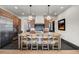 Kitchen with an island, modern lighting and stainless steel appliances at 1291 S Gaylord St, Denver, CO 80210