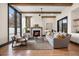 Bright living room with hardwood floors, fireplace, wooden beams and comfortable seating at 1291 S Gaylord St, Denver, CO 80210