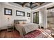 Sun-drenched main bedroom features large windows, a decorative ceiling and a patterned rug at 1291 S Gaylord St, Denver, CO 80210