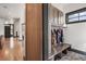 Bright mudroom boasts built-in storage, bench seating, and a window for natural light at 1291 S Gaylord St, Denver, CO 80210