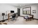 Bright office space features a large window, modern desk setup, and comfortable lounge area at 1291 S Gaylord St, Denver, CO 80210