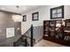 Elegant staircase features modern lighting, an art piece, and a charming chandelier at 1291 S Gaylord St, Denver, CO 80210