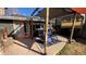 Backyard patio with comfortable chairs under a wooden pergola at 2033 S Ogden St, Denver, CO 80210