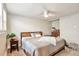 Comfortable bedroom with a bed, nightstand, and dresser at 2033 S Ogden St, Denver, CO 80210