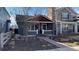 Charming single Gathering home with a red brick walkway and inviting covered porch at 2033 S Ogden St, Denver, CO 80210