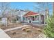 Inviting two-story home featuring a well-manicured front yard and charming walkway at 2033 S Ogden St, Denver, CO 80210