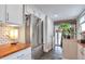 Bright kitchen featuring stainless steel appliances and brick accents at 2033 S Ogden St, Denver, CO 80210