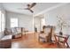 Open-concept living room showcasing hardwood floors, stylish furniture, and ample natural light at 2033 S Ogden St, Denver, CO 80210