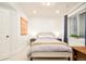 Bedroom featuring neutral walls, carpet, and a queen-size bed by a window with natural light at 449 N Pearl St, Denver, CO 80203