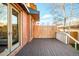 Spacious wooden deck providing an outdoor living area with brick house exterior at 449 N Pearl St, Denver, CO 80203