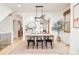 Bright dining room with hardwood floors, modern lighting, and an arched entrance at 449 N Pearl St, Denver, CO 80203