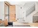 Inviting foyer with hardwood floors, staircase, and a stylish front door at 449 N Pearl St, Denver, CO 80203