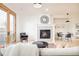 Spacious living area with a fireplace, hardwood floors, and access to the breakfast nook, creating a seamless living space at 449 N Pearl St, Denver, CO 80203