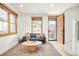 Cozy living room with a comfortable sofa and wood-trimmed windows at 449 N Pearl St, Denver, CO 80203