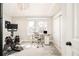 Home office space with large window and exercise equipment at 449 N Pearl St, Denver, CO 80203