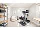 Bright office space with fitness area, open shelving and exercise bike at 449 N Pearl St, Denver, CO 80203