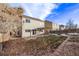 Exterior view of backyard featuring a wooden pergola, lawn, and privacy fence at 3869 S Himalaya Way, Aurora, CO 80013