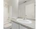 Bright bathroom features a large mirror, shower with a tub, and a toilet at 3869 S Himalaya Way, Aurora, CO 80013