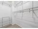 Walk-in closet featuring ample shelving with wire racks, perfect for organizing clothes and accessories at 3869 S Himalaya Way, Aurora, CO 80013