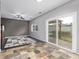 Bright living area featuring tile floors, sliding glass doors, and views of the backyard at 3869 S Himalaya Way, Aurora, CO 80013