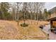Backyard area featuring a deck with an outdoor grill and wooded background at 2720 S Spring Gulch Rd, Idaho Springs, CO 80452
