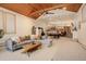 Open basement with fireplace, stairs to an upper floor, and a large seating area at 2720 S Spring Gulch Rd, Idaho Springs, CO 80452