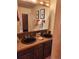 Bathroom featuring a double sink vanity, framed mirror and tile shower with glass door at 2720 S Spring Gulch Rd, Idaho Springs, CO 80452