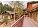 A large deck with railings and stairs that provides access to an upper level at 2720 S Spring Gulch Rd, Idaho Springs, CO 80452