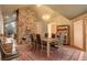 Elegant dining room featuring a stone fireplace and seating for six at 2720 S Spring Gulch Rd, Idaho Springs, CO 80452
