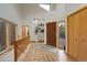 Entryway with tiled floor, closet, and wooden railing with an outside view at 2720 S Spring Gulch Rd, Idaho Springs, CO 80452