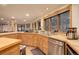 Bright and well-equipped kitchen with stainless steel appliances and natural wood cabinetry at 2720 S Spring Gulch Rd, Idaho Springs, CO 80452