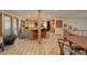 Spacious kitchen with breakfast bar and adjacent dining area, wood cabinets, and tile floor at 2720 S Spring Gulch Rd, Idaho Springs, CO 80452