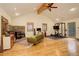 Versatile living room with wood floors, stone fireplace, sofa and gym equipment at 2720 S Spring Gulch Rd, Idaho Springs, CO 80452