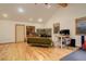 Multi-purpose living room featuring wood floors, fireplace and comfortable sofa at 2720 S Spring Gulch Rd, Idaho Springs, CO 80452