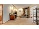 Living room with stone fireplace, desk, and a built-in curio cabinet at 2720 S Spring Gulch Rd, Idaho Springs, CO 80452