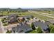 Aerial view of homes with a spacious field and mountain views in the background at 398 Midden Pl, Castle Rock, CO 80104