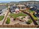 Aerial view of a landscaped backyard with play area and patio featuring outdoor seating at 398 Midden Pl, Castle Rock, CO 80104