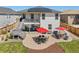 Spacious backyard with a patio, outdoor seating, fire pit, and a well-kept lawn at 398 Midden Pl, Castle Rock, CO 80104
