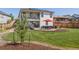 Beautiful backyard with a spacious patio, outdoor seating, and lush green lawn at 398 Midden Pl, Castle Rock, CO 80104