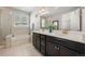Elegant bathroom with double vanity, soaking tub, glass shower, and neutral palette at 398 Midden Pl, Castle Rock, CO 80104