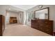 Bedroom with a vintage desk, dresser, neutral walls, and a window providing soft natural light at 398 Midden Pl, Castle Rock, CO 80104