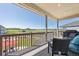 Covered deck with comfortable seating and beautiful views of open space and mountains at 398 Midden Pl, Castle Rock, CO 80104