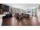Bright dining area featuring a wooden table, dark cabinets, and seamless access to living room at 398 Midden Pl, Castle Rock, CO 80104