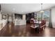 Spacious kitchen and dining area with dark wood cabinets, modern appliances, and lots of room at 398 Midden Pl, Castle Rock, CO 80104