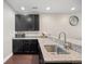 Well-appointed kitchenette featuring granite countertops, stainless steel sink, and ample cabinet space at 398 Midden Pl, Castle Rock, CO 80104