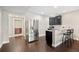Convenient kitchenette area with modern appliances, sleek countertops, and bar seating for casual dining at 398 Midden Pl, Castle Rock, CO 80104